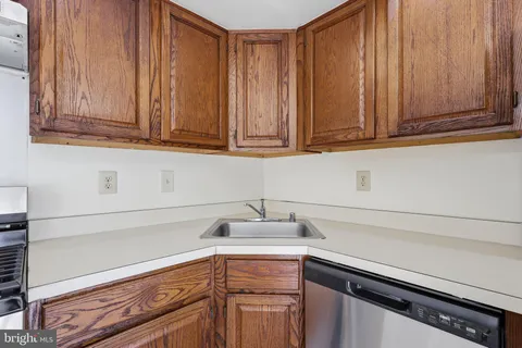 a kitchen with granite countertop cabinets and a sink