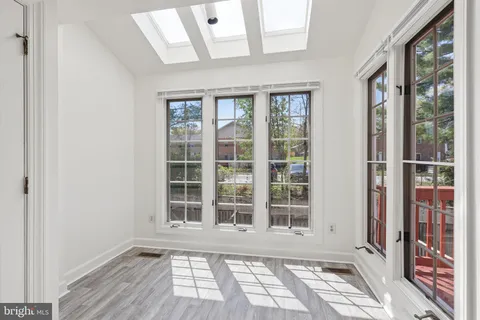 a view of a room with windows