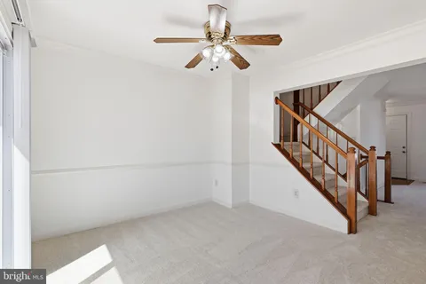 a view of a livingroom with a ceiling fan