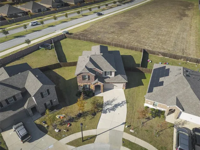 an aerial view of a house with outdoor space