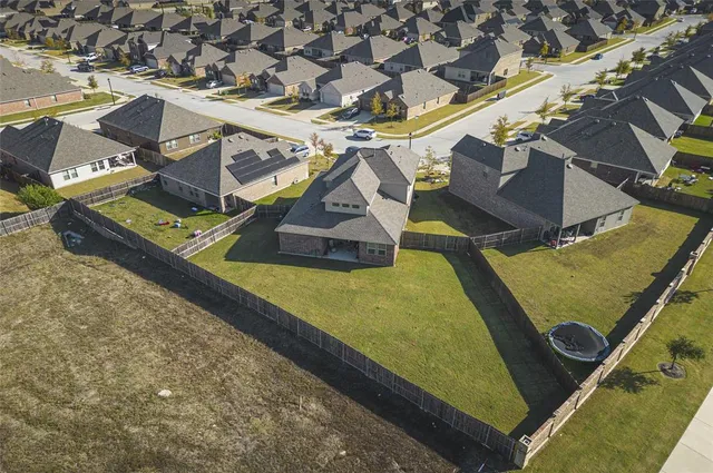 a view of a pool with chairs