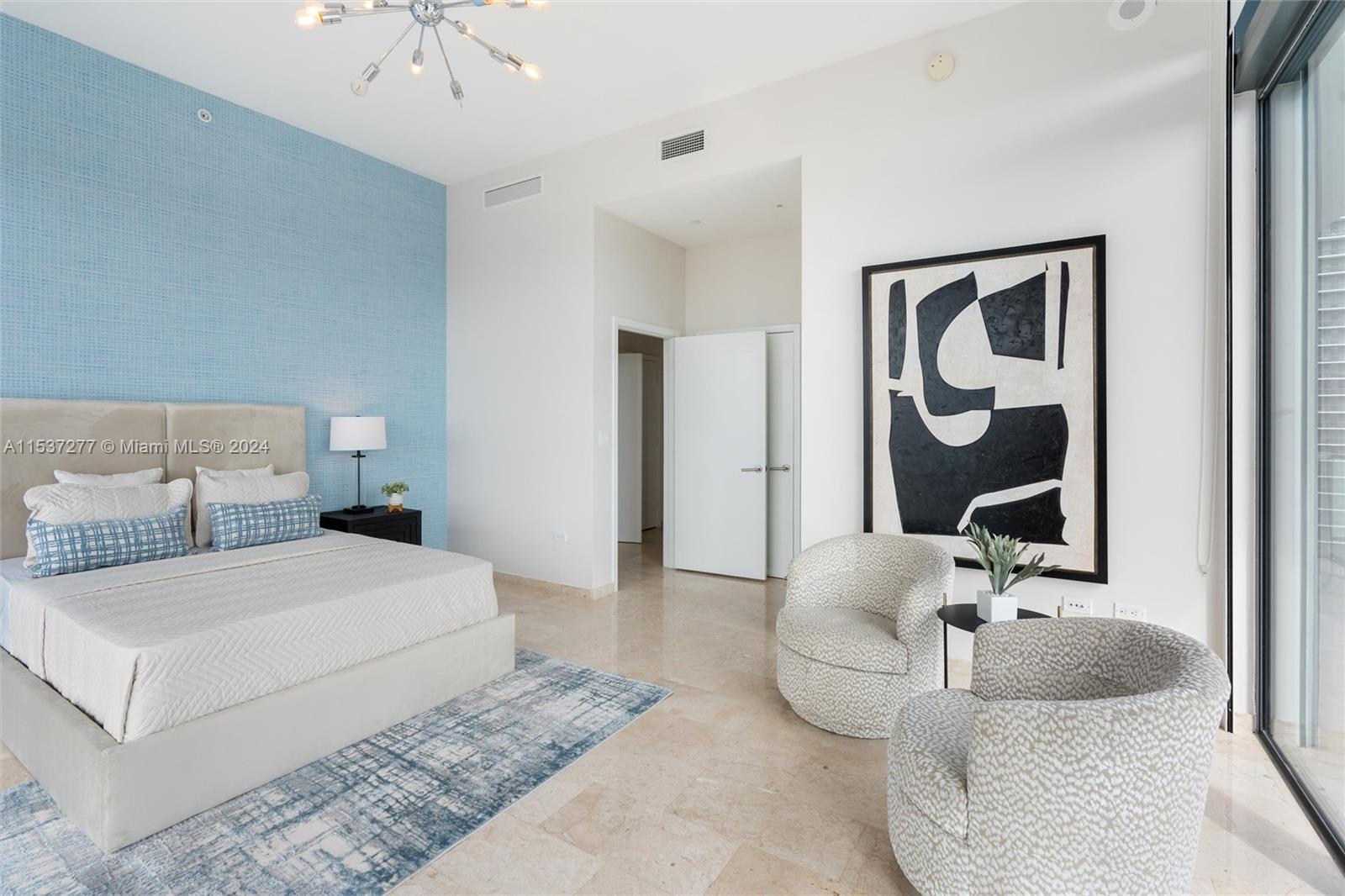 88 Southwest 7th Street, Unit 4001 Miami, FL 33130 - Photo 19 of 42 a bedroom with a bed and a couch