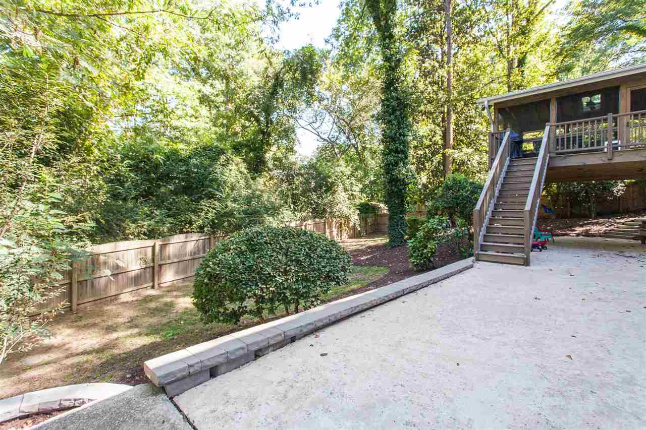 728 Catawba Street Raleigh, NC 27609 - Photo 23 of 26 The huge patio outside of the basement is a great spot for a fire pit or for the kids to zip around on their trikes. Patio