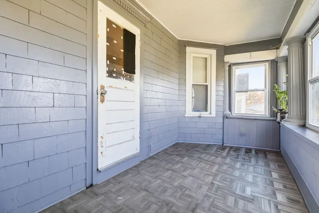 a view of an empty room with a window