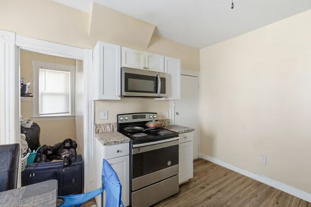 a kitchen with a stove and a microwave