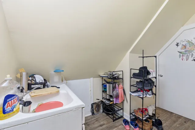 a white toilet sitting next to a bath tub