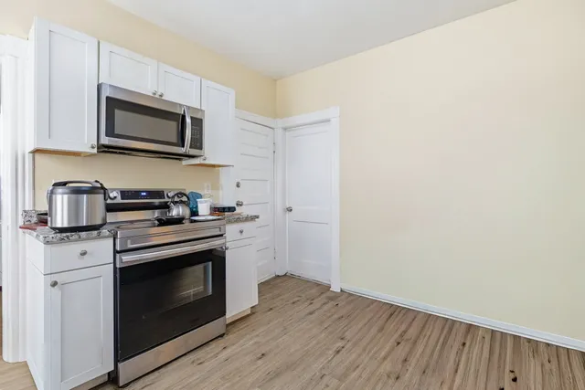 a kitchen with a stove and a microwave