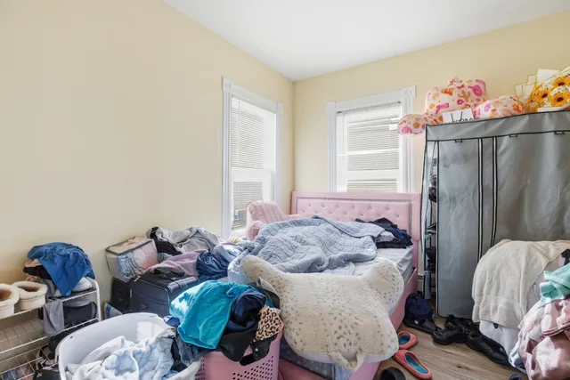 a bedroom with furniture and a window