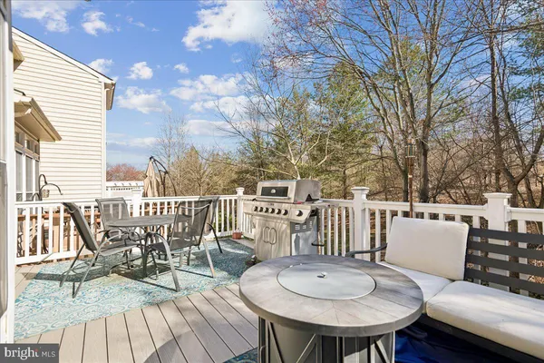 a view of a chairs and table on the deck
