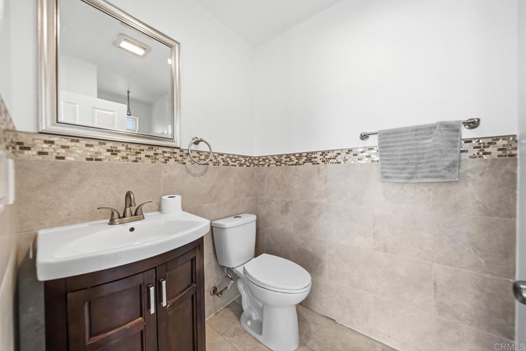 724 Felicita Avenue Spring Valley, CA 91977 - Photo 16 of 37 a bathroom with a sink a toilet and shower
