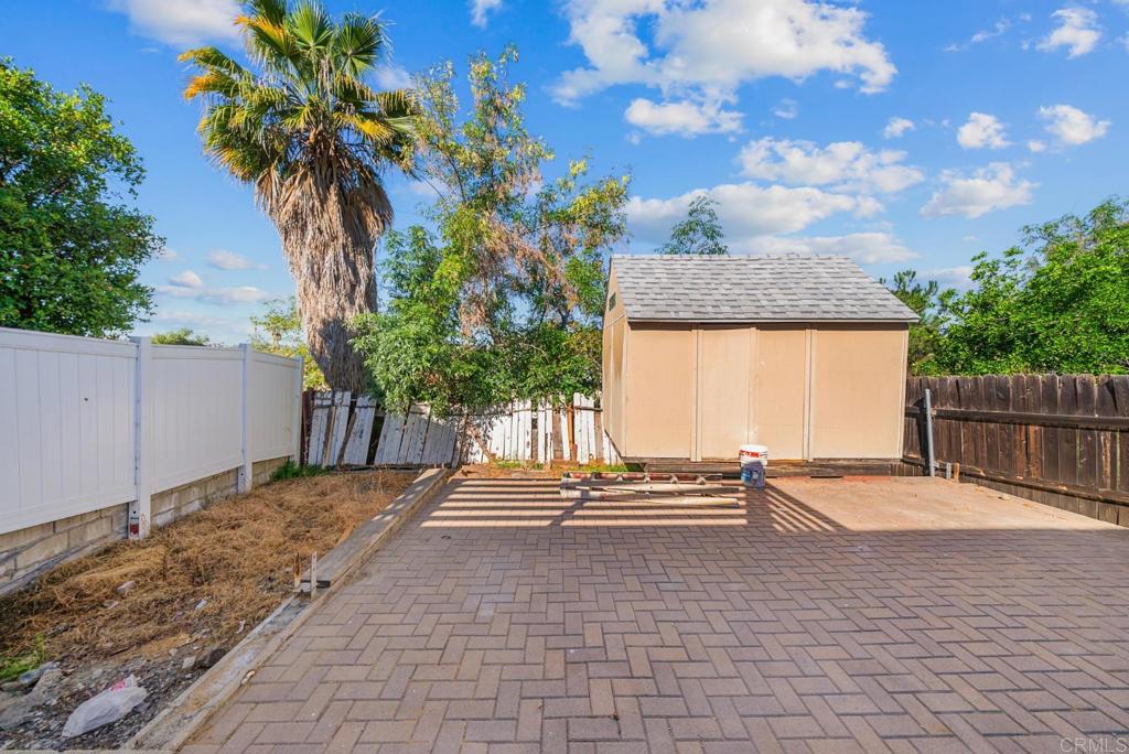 724 Felicita Avenue Spring Valley, CA 91977 - Photo 25 of 37 a backyard of a house with table and chairs