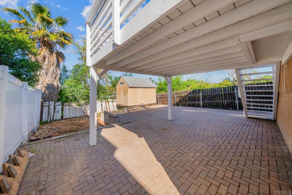 724 Felicita Avenue Spring Valley, CA 91977 - Photo 26 of 37 a backyard of a house with garden and outdoor seating