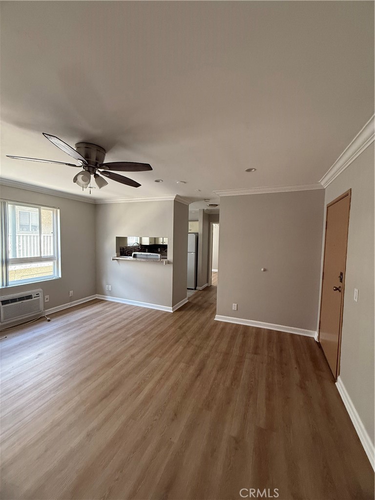 10900 Blix Street, Unit 4 North Hollywood, CA 91602 - Photo 2 of 10 wooden floor in an empty room with a window