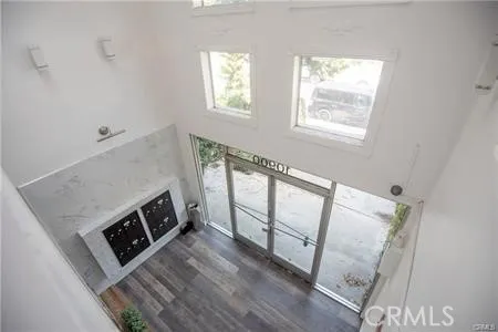 a view of a hardwood floor and a fireplace in a room