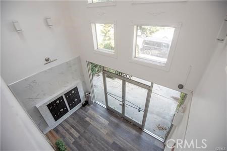 10900 Blix Street, Unit 4 North Hollywood, CA 91602 - Photo 8 of 10 a view of a hardwood floor and a fireplace in a room