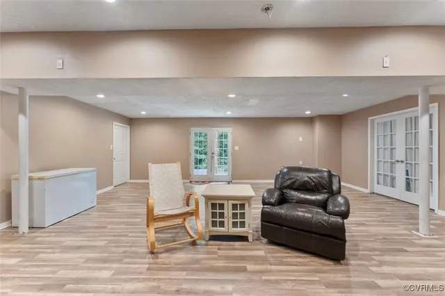 a spacious bathroom with a double vanity sink mirror and shower