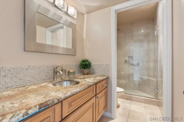 a large bathroom with a large tub sink and double vanity