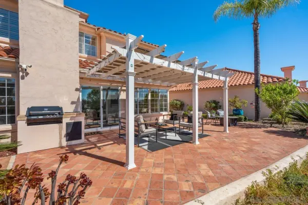 a view of a swimming pool with a patio