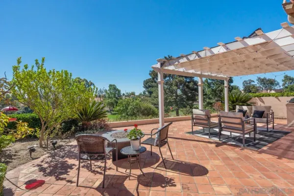 a view of outdoor kitchen with sitting area