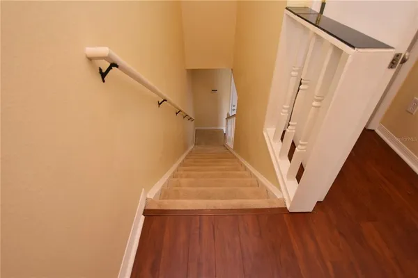 a view of stairs and wooden floor