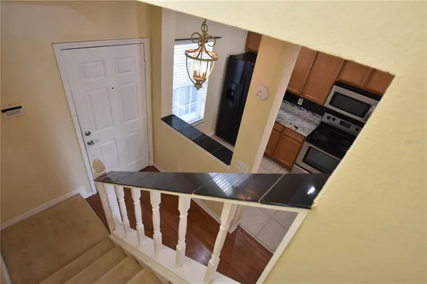 a kitchen with a stove microwave and refrigerator