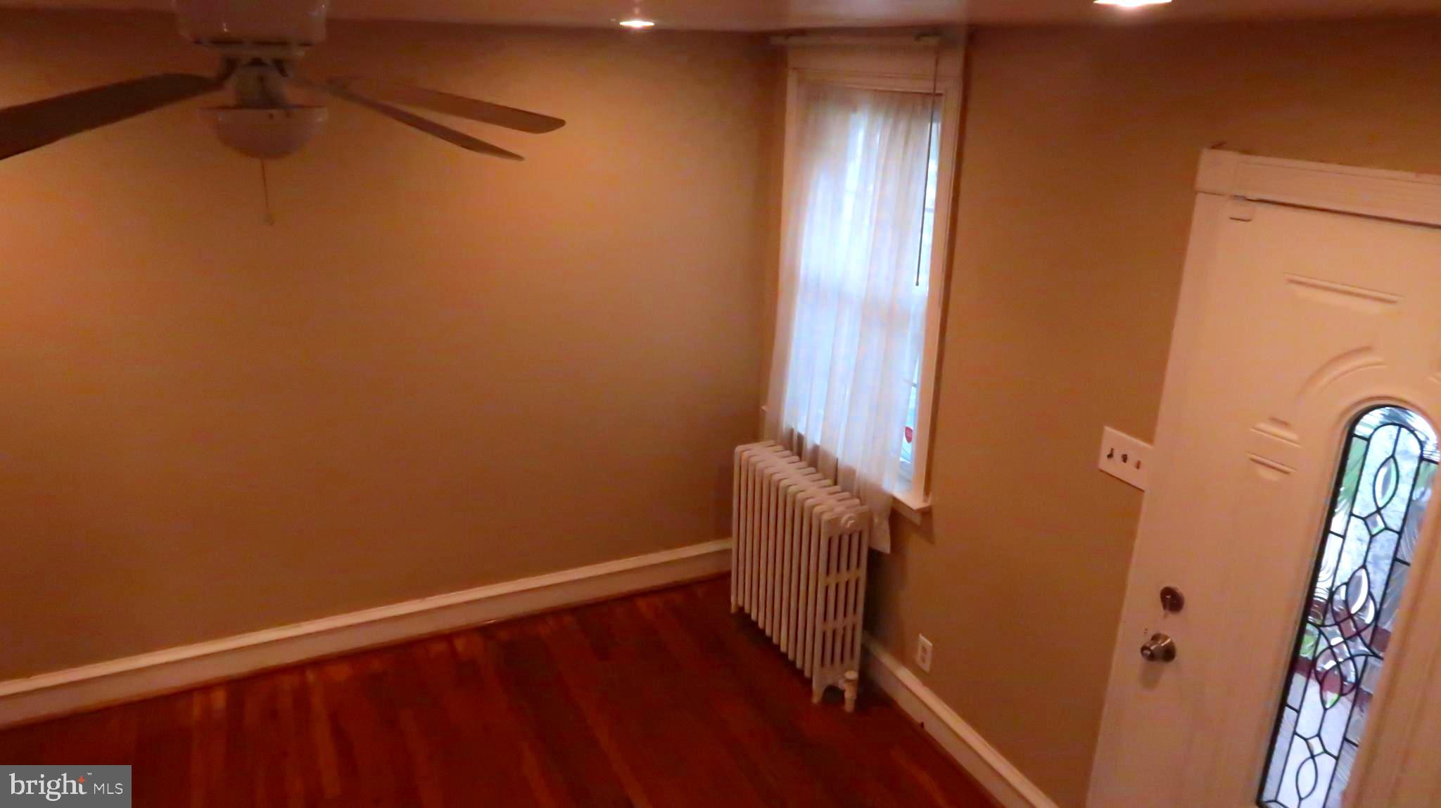 507 Woodcliffe Road Upper Darby, PA 19082 - Photo 8 of 38 a view of a room with wooden floor and staircase