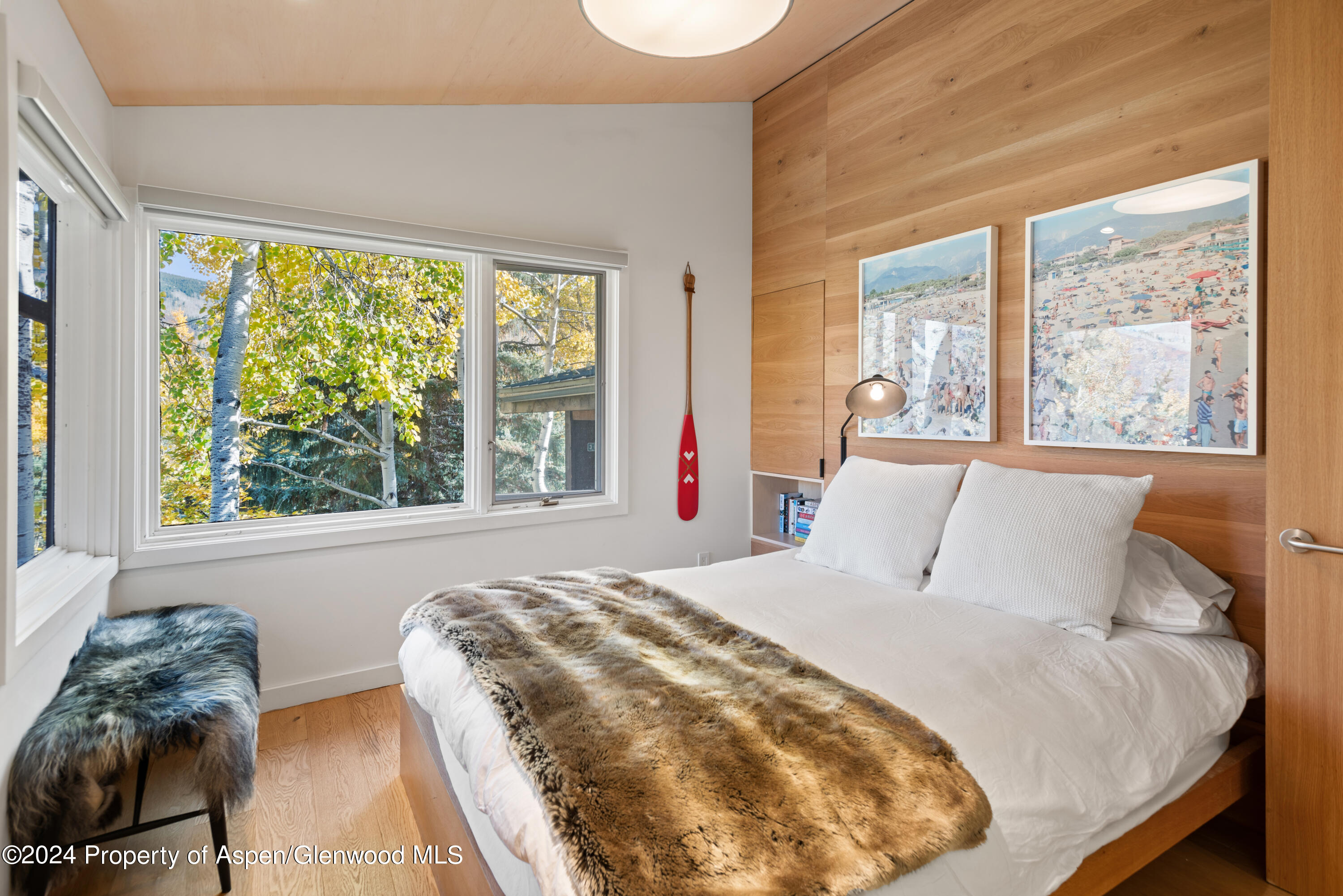 800 South Monarch Street, Unit 9 Aspen, CO 81611 - Photo 14 of 25 a bedroom with a bed and a large window