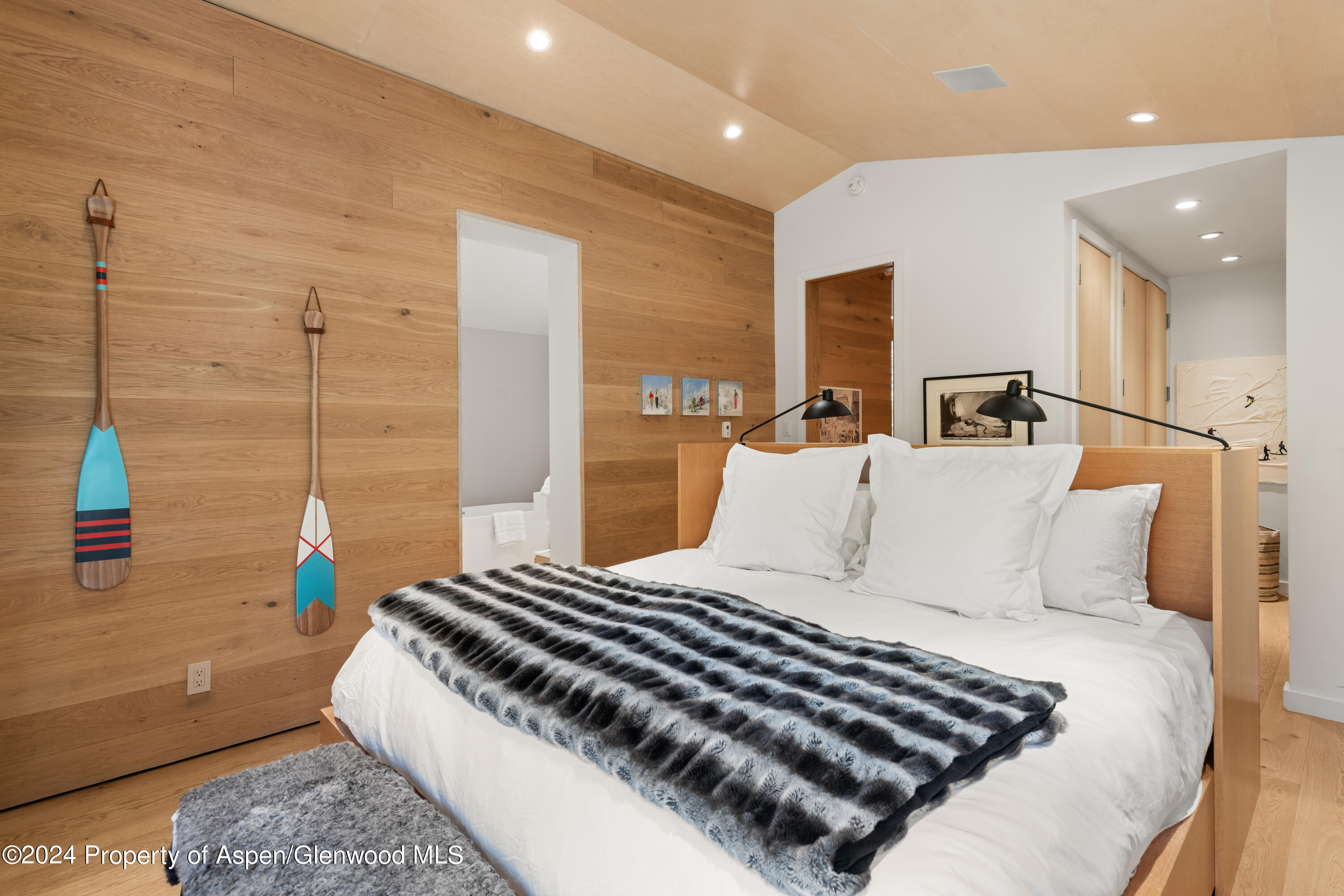 800 South Monarch Street, Unit 9 Aspen, CO 81611 - Photo 16 of 25 a bedroom with a bed and a potted plant