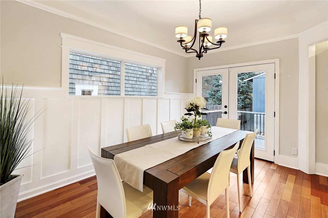 1936 47th Avenue Southwest Seattle, WA 98116 - Photo 11 of 25 a view of a dining room with furniture window and wooden floor