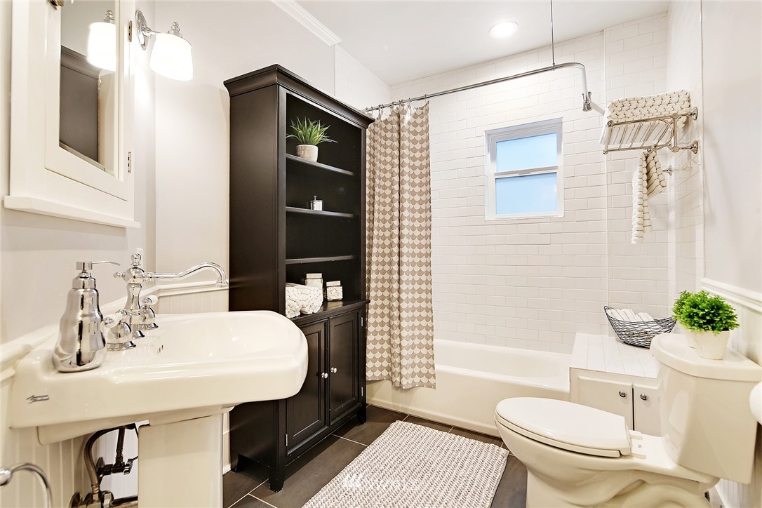 1936 47th Avenue Southwest Seattle, WA 98116 - Photo 18 of 25 a bathroom with a sink toilet and shower