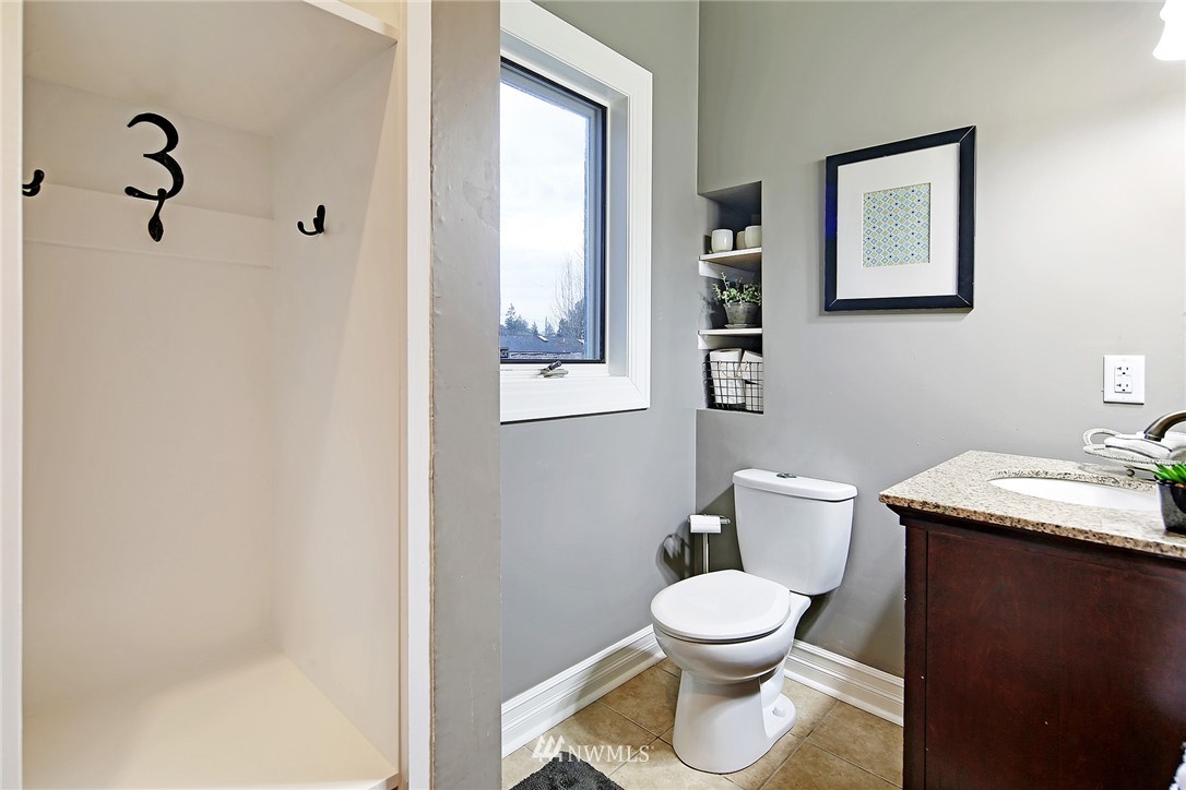 1936 47th Avenue Southwest Seattle, WA 98116 - Photo 19 of 25 a white toilet sitting next to a bathroom sink