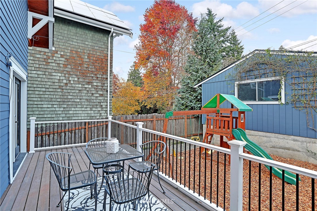 1936 47th Avenue Southwest Seattle, WA 98116 - Photo 23 of 25 a view of a deck with furniture and wooden deck