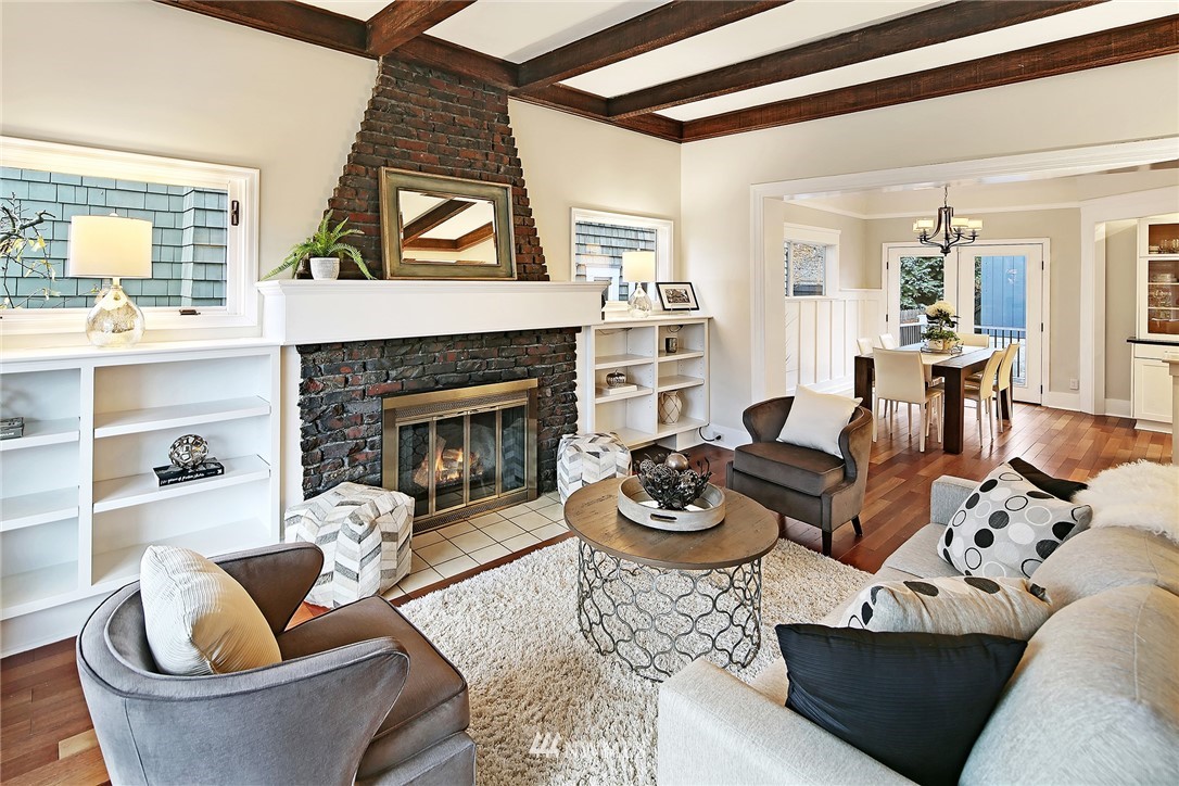 1936 47th Avenue Southwest Seattle, WA 98116 - Photo 5 of 25 a living room with furniture and a fireplace