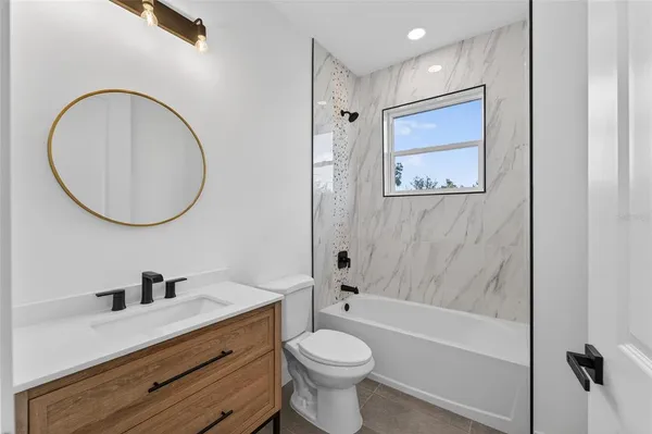 an aerial view of a house with a garden