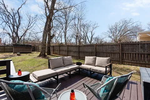 a view of a patio with couches chairs and a fire pit