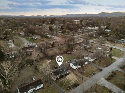 an aerial view of a highlighted house