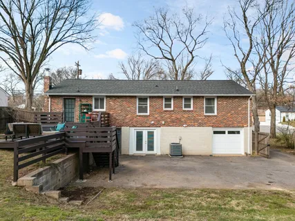 front view of a house with a bench