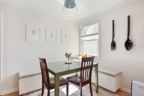a view of a dining room with furniture and window
