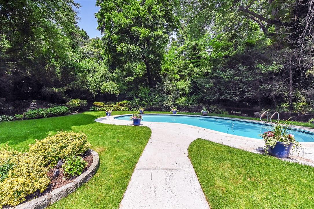 a view of swimming pool with a garden