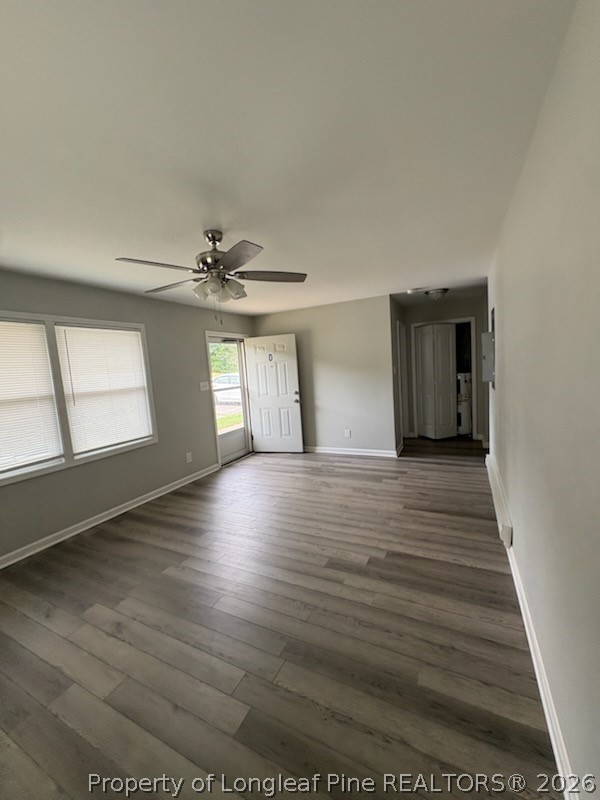 1051 Rulnick Street, Unit D Fayetteville, NC 28304 - Photo 4 of 5 a view of an empty room with wooden floor and a window