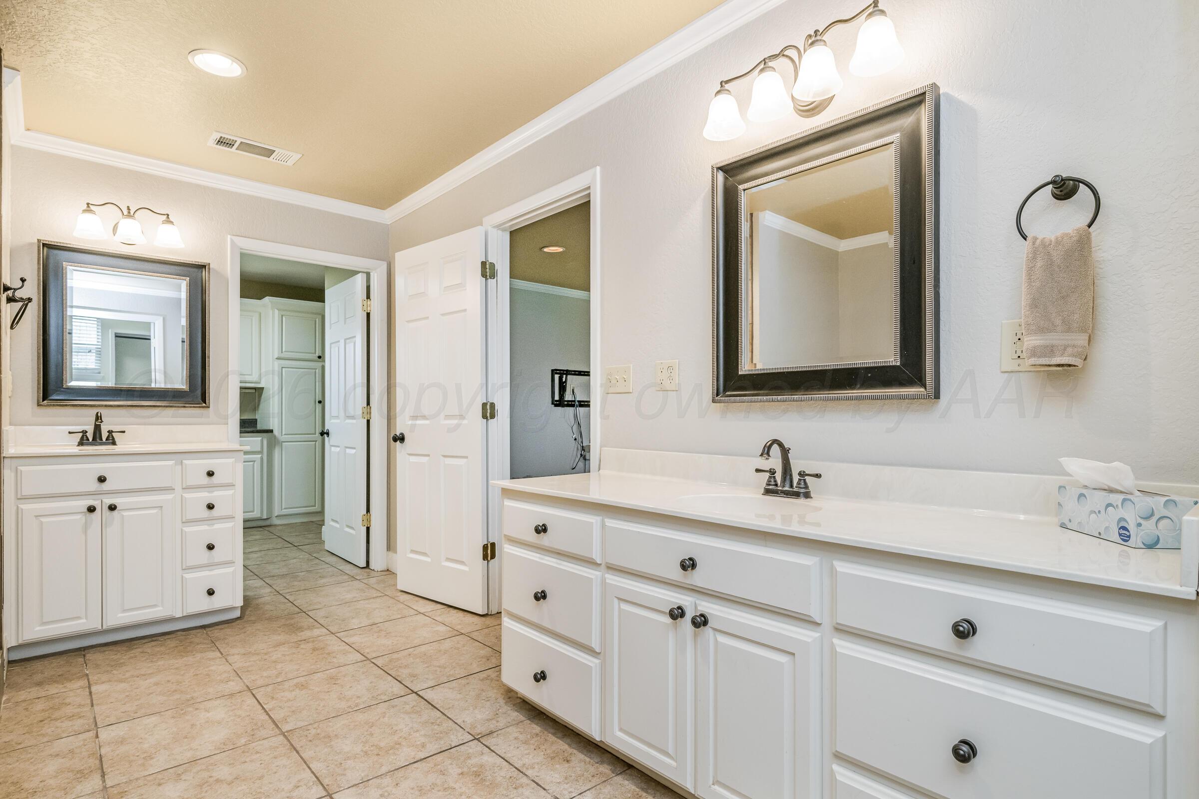 4400 West Farmers Avenue Amarillo, TX 79110 - Photo 17 of 27 a bathroom with a double vanity sink mirror and