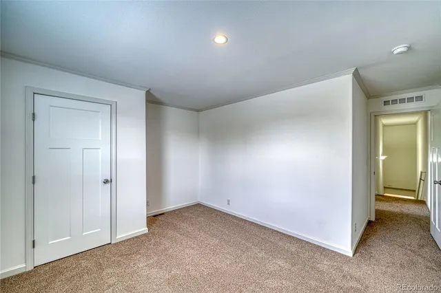 an empty room with closet area