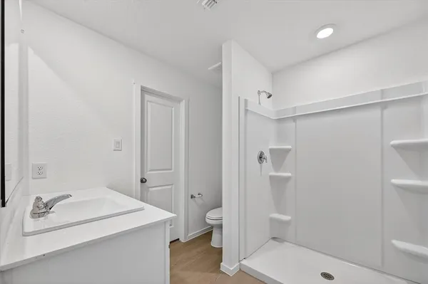 a bathroom with a bathtub and a toilet