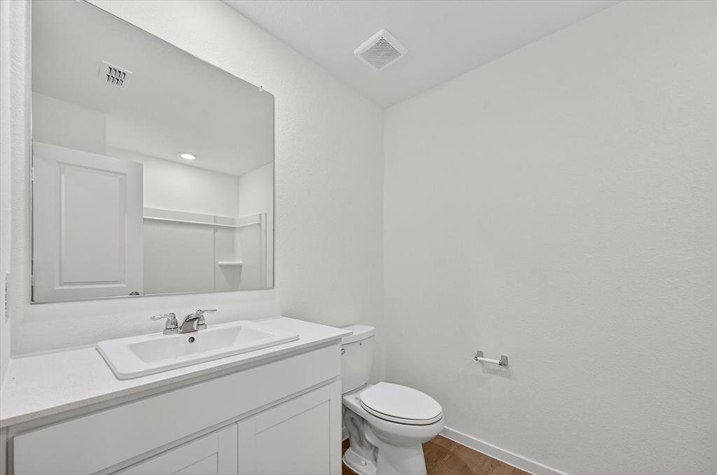 1609 Elliott Road Howe, TX 75459 - Photo 18 of 24 a bathroom with a sink and a toilet