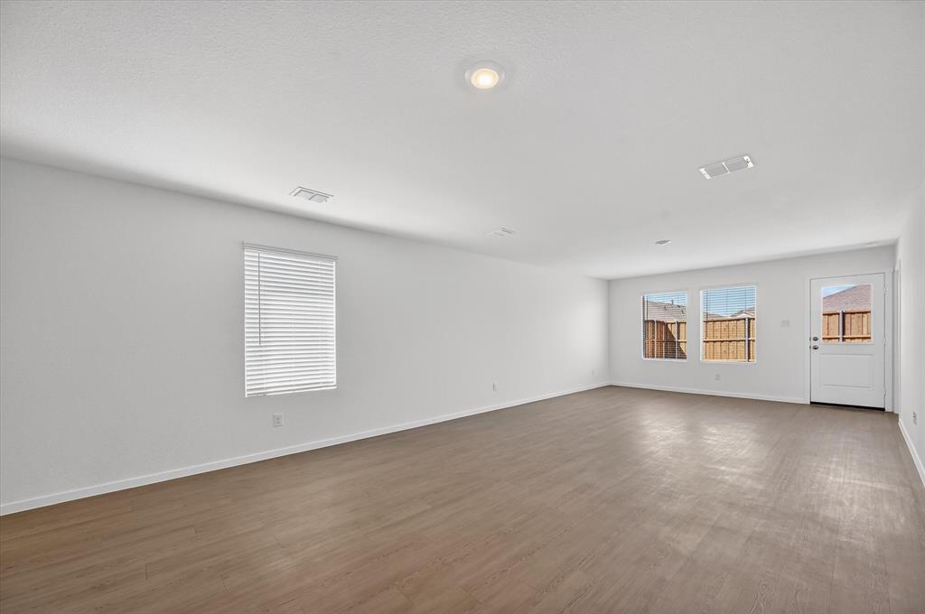 1609 Elliott Road Howe, TX 75459 - Photo 2 of 24 an empty room with windows