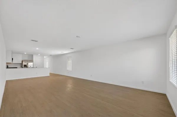 a view of a kitchen with a sink and a window