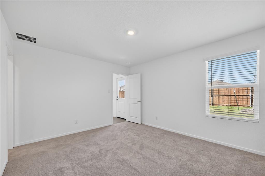 1609 Elliott Road Howe, TX 75459 - Photo 7 of 24 a view of an empty room with a window