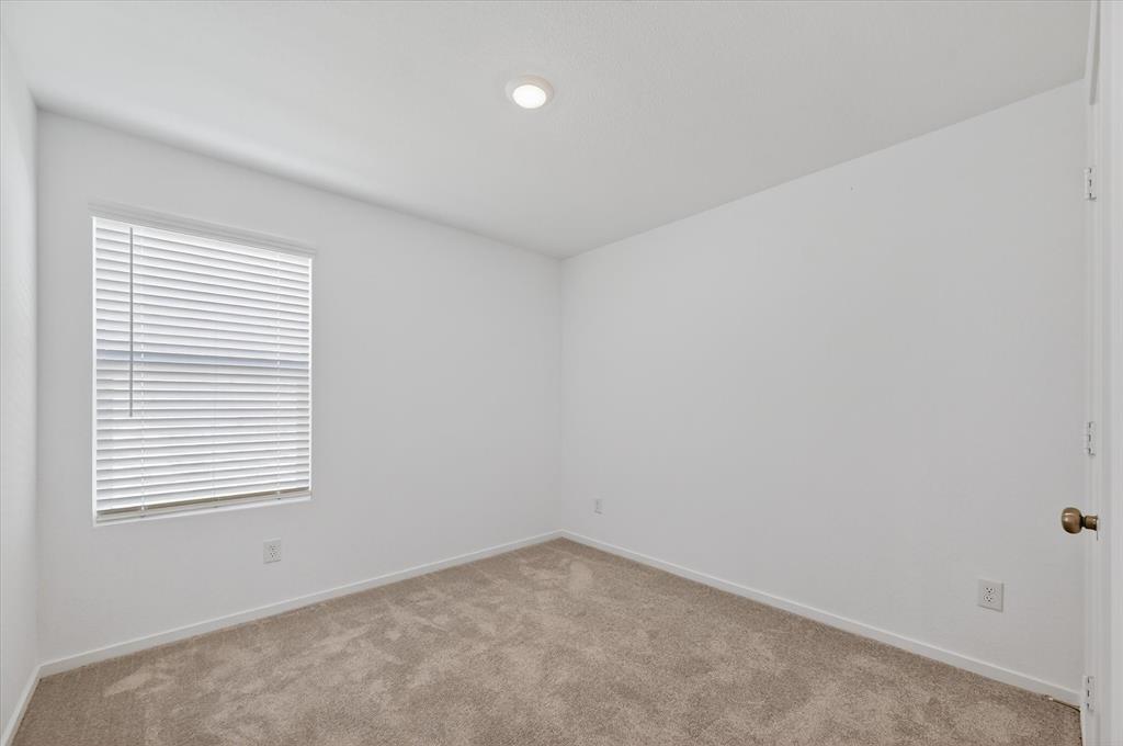 1609 Elliott Road Howe, TX 75459 - Photo 8 of 24 an empty room with a window