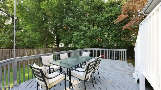 a view of backyard with furniture and trees