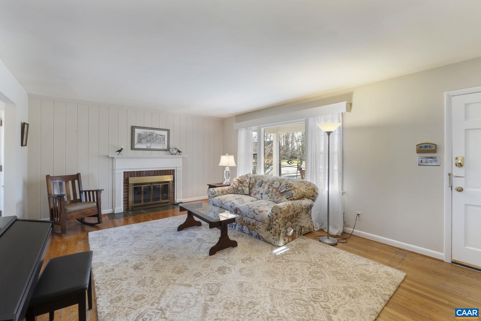 2225 Wakefield Road Charlottesville, VA 22901 - Photo 8 of 55 a living room with furniture and a fireplace